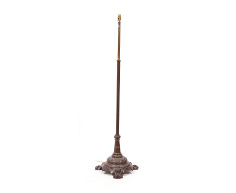 A LAMP STANDARD the cast base with paw feet 141cm high
