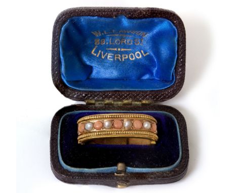 A SCARF CLASP WITH PEARL AND CORAL DECORATION  in fitted box from W.L. Lawson, Lord St, Liverpool
