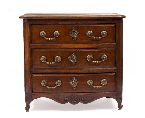 AN ANTIQUE OAK FRENCH PROVINCIAL CHEST OF THREE DRAWERS with brass handles and scroll feet, 88cm wide x 58cm deep x 81cm high
