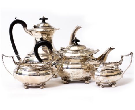 A MATCHED SILVER FOUR PIECE TEA AND COFFEE SET the teapot, sugar basin and milk jug with marks for Birmingham, the coffee pot