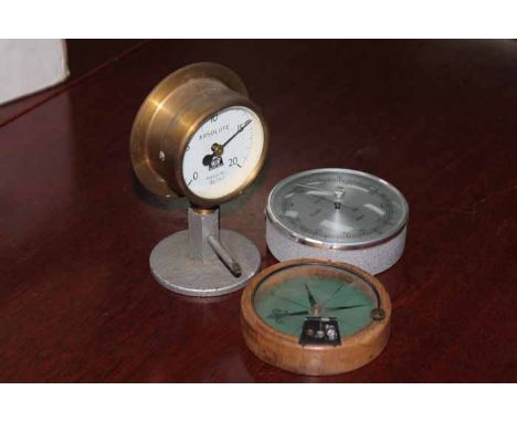 COMPASS, PRESSURE GAUGE AND A BAROMETER