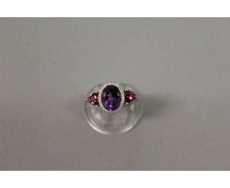 AN AMETHYST, PINK TOURMALINE AND DIAMOND 18CT WHITE GOLD RING.