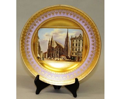 A GOOD VIENNA CIRCULAR LIGHT BLUE AND ACID GOLD PLATE, painted with a scene “Place de St. Etienne, Vienna”, figures and horse