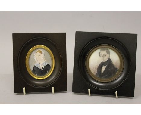 VICTORIAN SCHOOL CIRCULAR PORTRAIT OF A GENTLEMAN, 6.5cms diameter, and an oval of A LADY, 6cms x 4.5cms, both in wooden fram