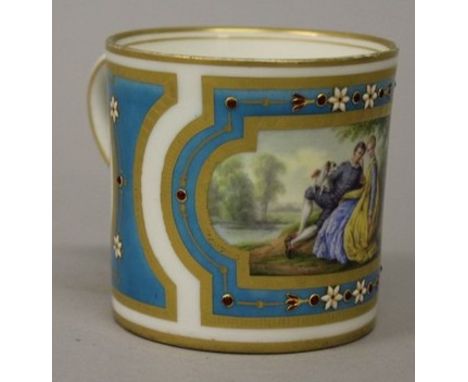 A SEVRES LIGHT BLUE CUP painted with a main panel of young lovers and two sepia oval panels of cupids 2.5ins high Sevres mark