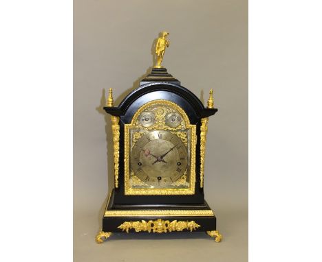 A GOOD VICTORIAN EBONY AND GILT BRACKET CLOCK with silent and chime, with five gongs, silvered dial and rich ormolu mounts 22