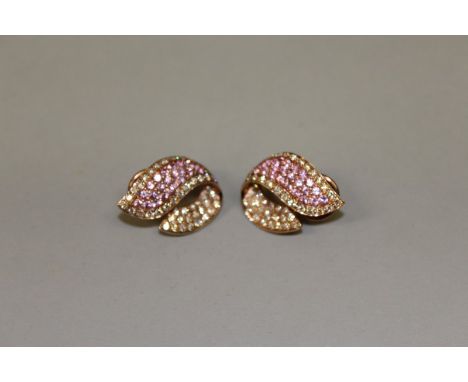 A PAIR OF PINK SAPPHIRE AND DIAMOND 18CT RED GOLD EARRINGS WITH OMEGA FITTINGS.