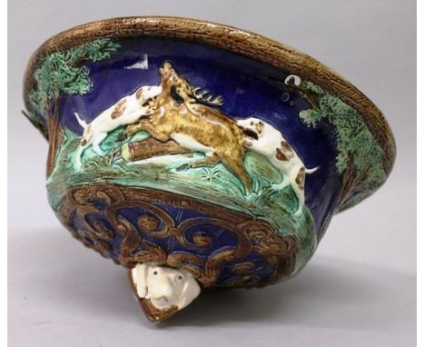 A VERY UNUSUAL MAJOLICA CIRCULAR LIGHT BOWL, possibly MINTON, decorated in relief with dogs attacking deer with a double dogs