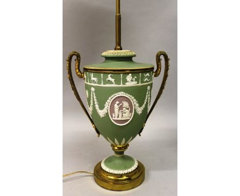 A WEDGWOOD GREEN AND WHITE JASPER URN SHAPED LAMP converted to electricity.