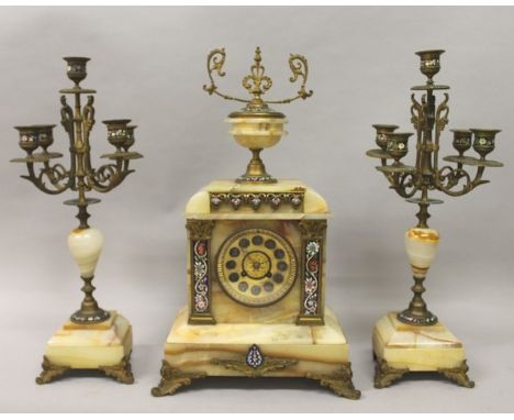 A GOOD 19TH CENTURY FRENCH ONYX AND CHAMPLEVE ENAMEL THREE PIECE CLOCK SET, the clock with eight day movement and urn finial,