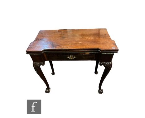 A George III inverted breakfront mahogany fold over card table, fitted with a short drawer on carved cabriole legs terminatin