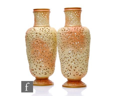 A pair of Worcester Locke &amp; Co reticulated vases, circa 1900, of shouldered form with tall drawn neck, on foliate moulded