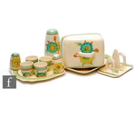 A Clarice Cliff Lynton shape cheese dish and cover, circa 1936, hand painted with flower heads and green and brown banding, A