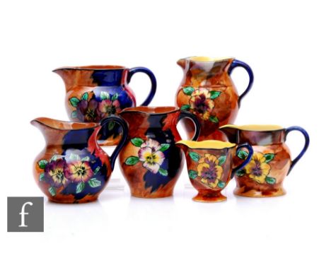 A collection of Hollinshead &amp; Kirkham, H &amp; K Tunstall Art Deco hand painted Viola pattern earthenware designed by R G