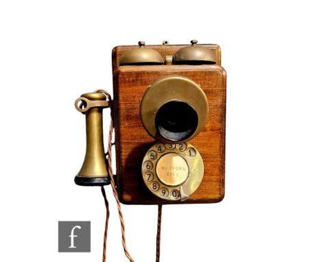 A late 1920s Bell mark 235 wall telephone, mahogany cased, brass fittings and ebonite speaker, hinged front opening,&nbsp;hei