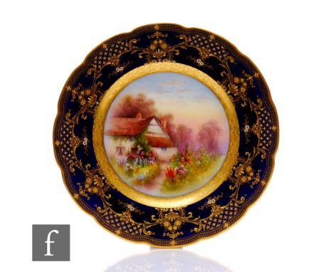 A Royal Worcester cabinet plate painted by R Rushton, circa 1918, of circular form, decorated with a rural cottage with flowe