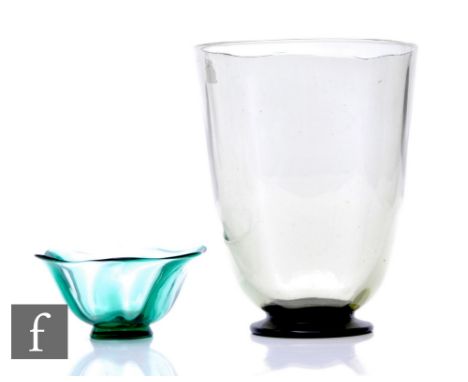 A large 1930s glass vase in the manner of Orrefors, the sea green optic moulded bowl raised to a deep green foot, height 25cm