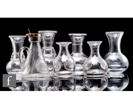 A collection of six assorted 19th Century spirit measures, to include plain, engraved and pillar moulded examples, with a jug