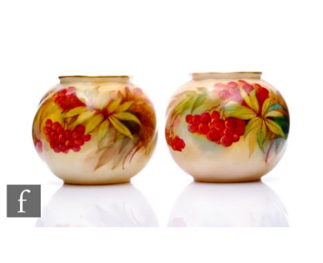 Two Royal Worcester vases by Kitty Blake, circa 1930, of spherical form with shaped gilded rim, decorated with leaves and ber
