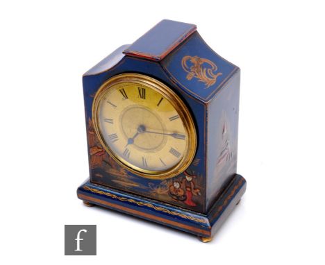 A 1920s mantle clock in blue chinoiserie lacquer, circular dial, the shaped case decorated with figures, on brass ball feet, 