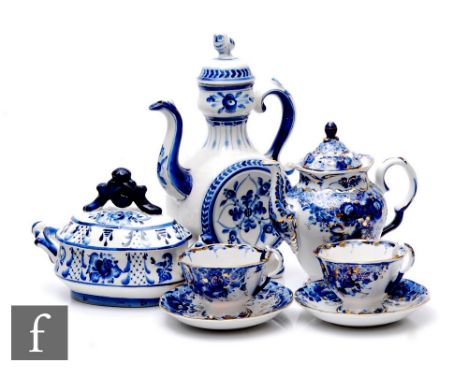 A Russian Gzehl blue and white tea set for two, comprising teapots, cups and saucers, a similar coffee pot, of flattened circ