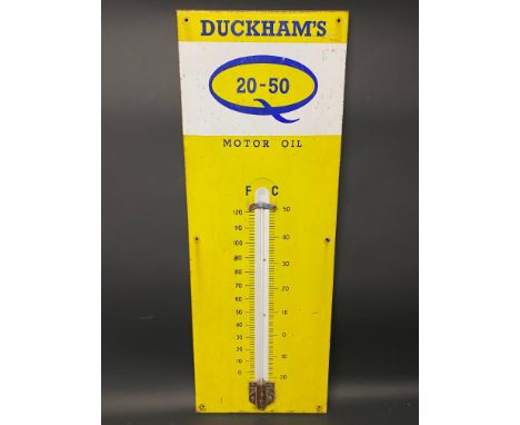 A Duckham's 20-50 Motor Oil enamel sign, 13 x 36".