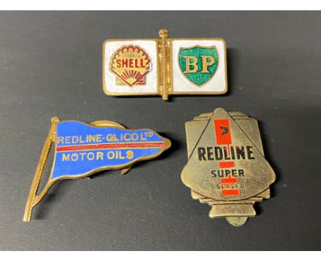 A Redline-Glico enamel lapel badge, a Redline Super badge and a third for Shell-BP.