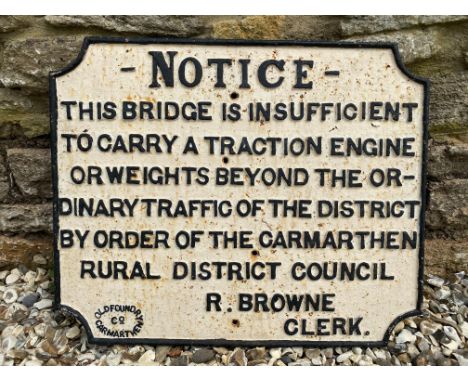 An early cast iron Notice road sign informing that the bridge 'is insufficient to carry a traction engine...by order of the C