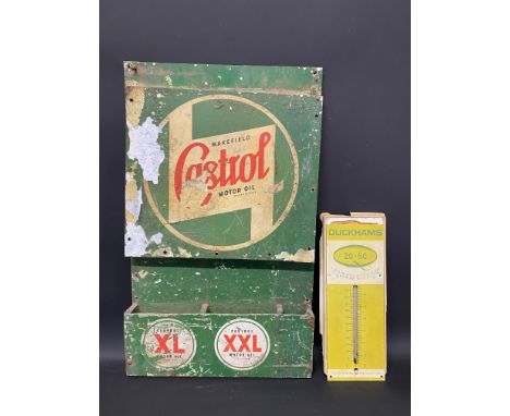An unusual Wakefield Castrol wall mounted rack and a small Duckhams 20-50 thermometer.