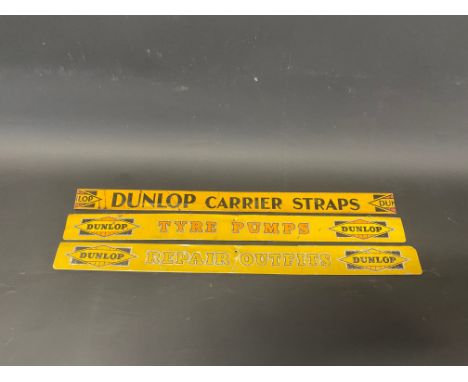 A Dunlop Carrier Straps advertising shelf strip and two later Dunlop shelf strips.