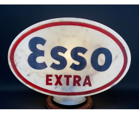 An Esso Extra glass petrol pump globe, stamped British Made and 'Property of Anglo American Oil Co Ltd, dated February 1951, 