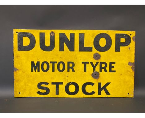 An early Dunlop Motor Tyre Stock rectangular double sided enamel sign, lacking hanging flange and trimmed, 23 1/2 x 13 1/4".