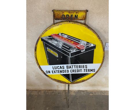 A Lucas Batteries circular enamel sign, in a garage forecourt spinning frame, with open/closed attachment, the main sign in f
