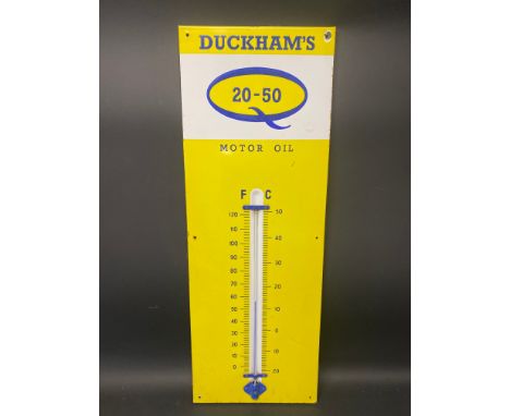 A Duckham's 20-50 Motor Oil enamel thermometer sign, 13 x 36".