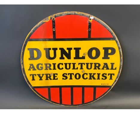 A Dunlop Agricultural Tyre Stockist circular double sided enamel sign, 24" diameter.