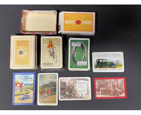 A selection of playing cards all with advertising, including Davies tyres and Raleigh, plus some individual cards with car ma