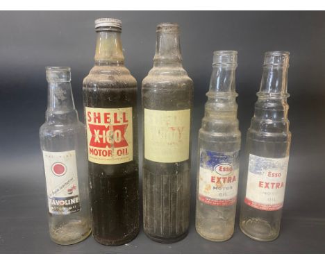 Two Esso Extra Motor Oil pint bottles, a Havoline pint bottle and two Shell X-100 quart bottles.