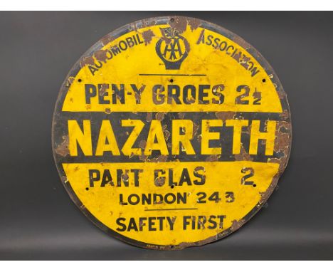 An AA circular yellow and black enamel road/village sign for Nazareth, made by Franco, older amateur retouching, 30" diameter
