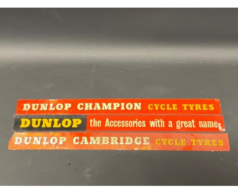 Three Dunlop shelf mounted advertising strips.