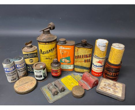 A group of small oil cans and other tins including Raleigh.