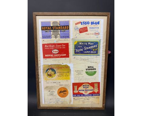 A framed and glazed group of several garage invoices, all with brightly coloured advertising including White May and Royal St