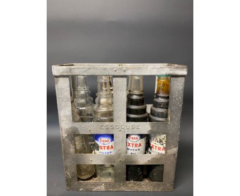 An Essolube eight division oil bottle crate containing three quart Esso Extra bottles, three quart Esso bottles and an Esso p