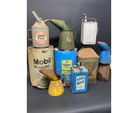 A selection of assorted cans including Esso Blue, Castrol etc.
