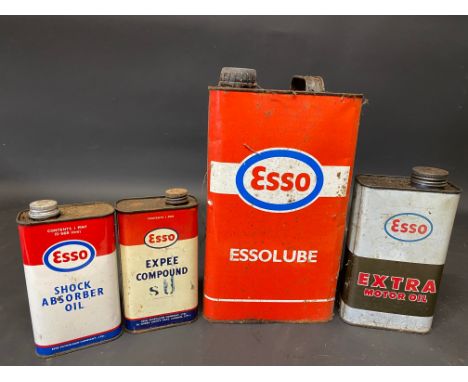 Four assorted Esso oil cans.
