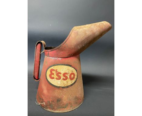 An Esso gallon measure.