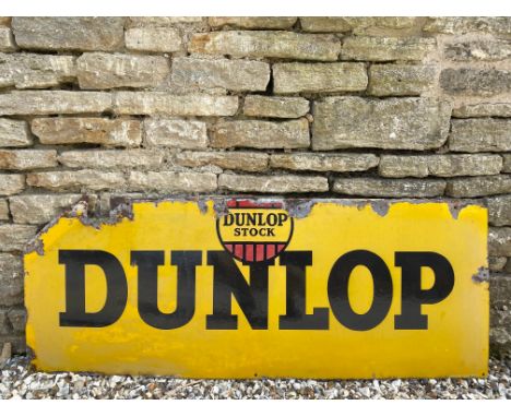 A Dunlop Stock rectangular enamel sign, 54 1/4 x 21".