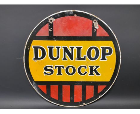 A Dunlop Stock circular double sided enamel sign, 18" diameter.