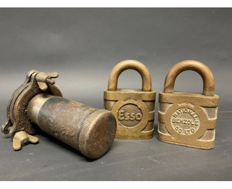 A Castrol bulk oil dispensing tap, a National Benzole padlock and another for Esso.