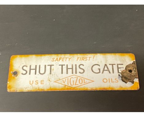 A small Vigzol Oils 'Shut this gate' enamel sign, 7 1/2 x 2 1/2".