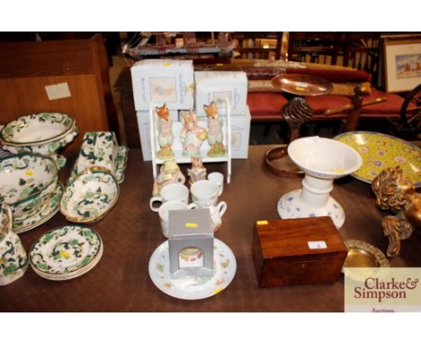 A collection of Royal Albert Beatrix Potter figures complete with original boxes; Wedgwood Beatrix Potter cups and teaware; a